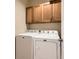 Convenient laundry room features a modern washer and dryer set and ample storage space at 9470 Loggia St # D, Highlands Ranch, CO 80126