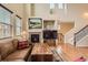 Comfortable living room featuring a fireplace, hardwood floors and an abundance of natural light at 9470 Loggia St # D, Highlands Ranch, CO 80126