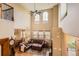 Elevated view of a living room with high ceilings, abundant natural light, and hardwood floors at 9470 Loggia St # D, Highlands Ranch, CO 80126