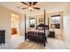Comfortable main bedroom showcasing a large four-poster bed and serene natural light at 9470 Loggia St # D, Highlands Ranch, CO 80126