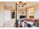 Spacious main bedroom with a four-poster bed, carpeted floor, and neutral color palette at 9470 Loggia St # D, Highlands Ranch, CO 80126