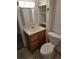 Bathroom featuring a vanity with storage, a mirror, and a toilet at 2350 / 2352 Garland St, Lakewood, CO 80215