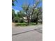 Cozy home surrounded by mature trees and lush greenery, conveniently located near a street with a mailbox at 2350 / 2352 Garland St, Lakewood, CO 80215