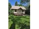Inviting home featuring a classic front porch, well-maintained lawn, and appealing exterior paint at 2350 / 2352 Garland St, Lakewood, CO 80215