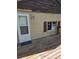 Side of house with deck access and a window to the inside at 2350 / 2352 Garland St, Lakewood, CO 80215