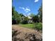 Charming home with wood siding, a cozy front porch, and mature trees in a serene setting at 2350 / 2352 Garland St, Lakewood, CO 80215