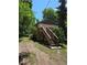 Home surrounded by mature trees, showcasing its natural setting and peaceful ambiance at 2350 / 2352 Garland St, Lakewood, CO 80215