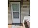 Close up of home's front door with charming details, address, and classic architectural elements at 2350 / 2352 Garland St, Lakewood, CO 80215