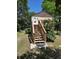 Charming home with wooden staircase leading to deck, set amidst a lush, verdant landscape at 2350 / 2352 Garland St, Lakewood, CO 80215