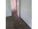 Hallway with neutral carpet, white walls and doors, offering a calming transition between spaces at 2350 / 2352 Garland St, Lakewood, CO 80215