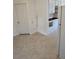 Kitchen features white cabinets, classic flooring, and access to multiple rooms at 2350 / 2352 Garland St, Lakewood, CO 80215