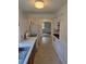 Kitchen with white appliances, window views, and classic layout at 2350 / 2352 Garland St, Lakewood, CO 80215