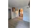 Carpeted living room shows view of kitchen with white refrigerator at 2350 / 2352 Garland St, Lakewood, CO 80215