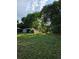 Backyard shed for extra storage, with abundant greenery and trees at 2350 / 2352 Garland St, Lakewood, CO 80215