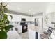 Modern kitchen with white cabinets and island at 5484 S Ireland Way, Centennial, CO 80015