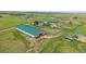 Aerial view of horse property featuring large barn, fenced pasture and serene country setting at 9255 N Delbert Rd, Parker, CO 80138