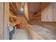 Unfinished basement with built-in shelves, exposed ceiling and concrete floor at 9255 N Delbert Rd, Parker, CO 80138