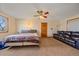 Large bedroom featuring a leather sofa, and two windows offering plenty of natural light at 9255 N Delbert Rd, Parker, CO 80138