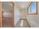 Spacious walk-in closet with carpet and lots of natural light coming in from the window at 9255 N Delbert Rd, Parker, CO 80138