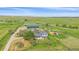 Charming home exterior featuring a well-maintained lawn, mature trees, and an outbuilding in a serene setting at 9255 N Delbert Rd, Parker, CO 80138