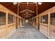 Inside the horse barn you will find clean stalls, skylights, and a concrete alleyway for the horses to walk on at 9255 N Delbert Rd, Parker, CO 80138