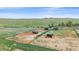 A sunny, fenced paddock area with several horse shelters, ready for your horses on this beautiful property at 9255 N Delbert Rd, Parker, CO 80138