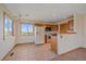Bright kitchen with white appliances, wood cabinetry and large window at 9255 N Delbert Rd, Parker, CO 80138