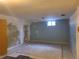 Spacious basement featuring a clean rug and a small window for natural light at 5274 W Rowland Pl, Littleton, CO 80128