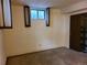 Basement with small window, an air vent and access to closet at 5274 W Rowland Pl, Littleton, CO 80128