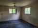 Spacious bedroom offering natural light from two windows and ceiling fan at 5274 W Rowland Pl, Littleton, CO 80128