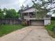 View of house with deck showing a garage at 5274 W Rowland Pl, Littleton, CO 80128