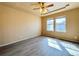 Bedroom featuring ceiling fan, fresh paint and carpet, and a window with a view at 6725 S Winnipeg Cir # 106, Aurora, CO 80016