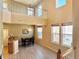 Bright dining room featuring a wooden table, multiple windows, and an open staircase at 6725 S Winnipeg Cir # 106, Aurora, CO 80016