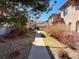 Townhome exteriors on a landscaped sidewalk at 6725 S Winnipeg Cir # 106, Aurora, CO 80016