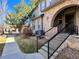 Lovely townhouse features a brick archway, manicured lawn, and a welcoming entrance at 6725 S Winnipeg Cir # 106, Aurora, CO 80016