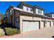 Exterior shows a two-story townhome with a brick facade and attached one-car garage with gray door at 6725 S Winnipeg Cir # 106, Aurora, CO 80016