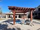 Relaxing community hot tub under a wooden pergola with outdoor seating, perfect for residents to unwind at 6725 S Winnipeg Cir # 106, Aurora, CO 80016