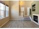 The living room has a fireplace and leads to the staircase to the upper floor at 6725 S Winnipeg Cir # 106, Aurora, CO 80016