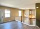 The upper floor loft area has light wood flooring and a view of the main floor below at 6725 S Winnipeg Cir # 106, Aurora, CO 80016