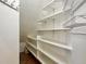 The white pantry shelves provide an abundance of storage at 6725 S Winnipeg Cir # 106, Aurora, CO 80016
