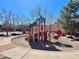 Community playground featuring colorful play structure, slide, and climbing areas for enjoyment and recreation at 6725 S Winnipeg Cir # 106, Aurora, CO 80016