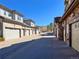 Street view of townhome garages and townhome exteriors at 6725 S Winnipeg Cir # 106, Aurora, CO 80016