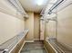 Walk-in closet featuring extensive wire shelving and gray wood-look flooring at 6725 S Winnipeg Cir # 106, Aurora, CO 80016