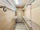 Walk-in closet with extensive wire shelving and gray wood-look flooring at 6725 S Winnipeg Cir # 106, Aurora, CO 80016