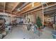 Unfinished basement offers room for storage and recreation with exposed ceiling at 5178 Netherland St, Denver, CO 80249