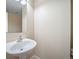 Bathroom featuring a pedestal sink and simple design at 5178 Netherland St, Denver, CO 80249