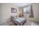 Bedroom with stylish decor, plush rug, and natural lighting at 5178 Netherland St, Denver, CO 80249
