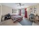 Bedroom featuring ceiling fan, window, and colorful accents at 5178 Netherland St, Denver, CO 80249