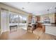 Eat-in kitchen features sliding glass doors to a deck, wood cabinets, and stainless appliances at 5178 Netherland St, Denver, CO 80249