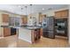 Modern kitchen features wood cabinets, laminate countertop island, and stainless steel appliances at 5178 Netherland St, Denver, CO 80249
